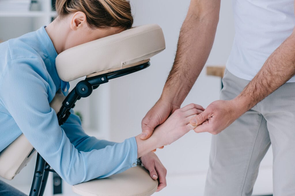 Image of a massage therapist providing tulsa chair massage