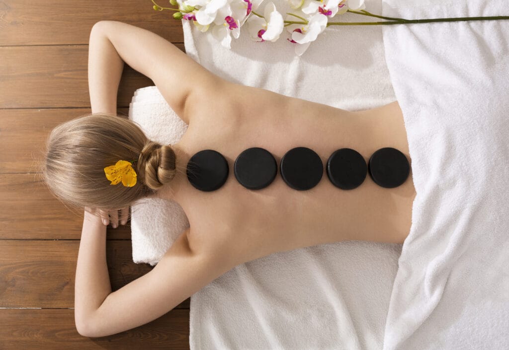 spa stone massage concept girl on massage table 2021 08 27 14 46 57 utc | Medical Massage of Tulsa