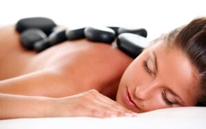 Woman enjoying a hot stone massage