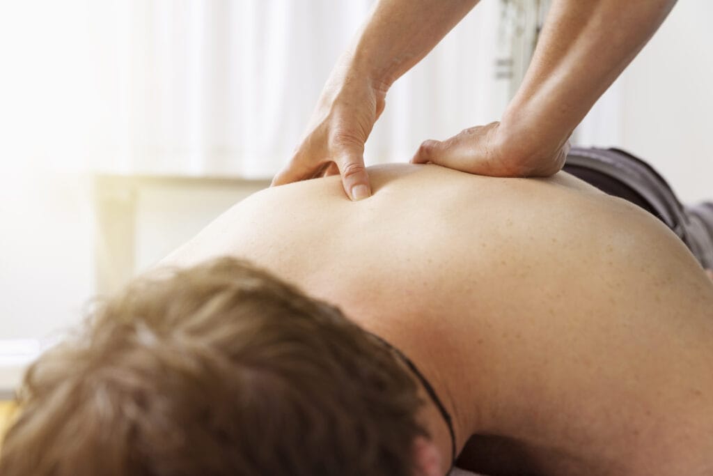 A male patient receiving relaxing swedish Massage services at our Tulsa location.