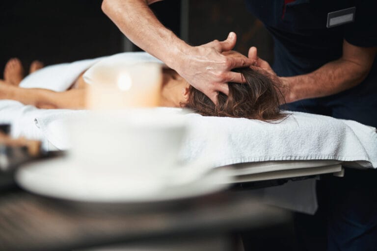 Massage Tulsa picture of a therapist massaging a patient's head